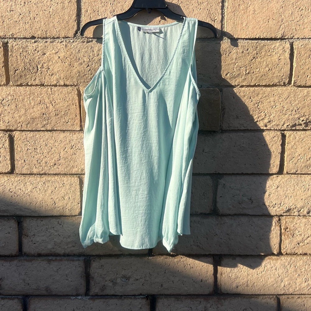 Light mint green open sleeved Jennifer Lopez top